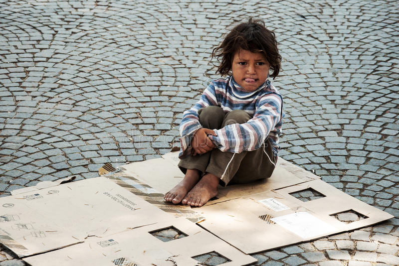 unknown-homeless-kid-sitting-street-tirana-albania-may-old-box-tirana-43944722